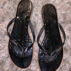 Black patent leather Coach flip flops